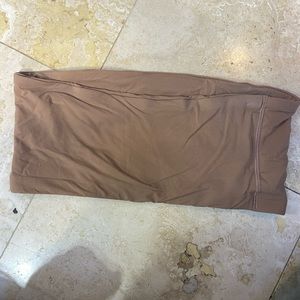 Skims medium never worn . Tried on to small